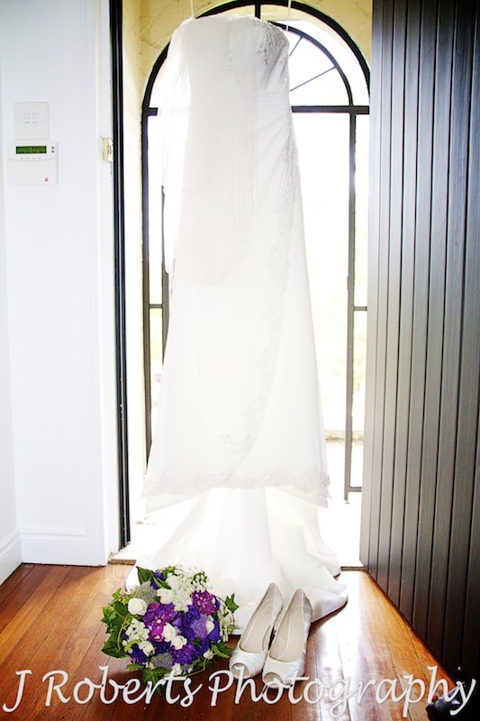 wedding dress and shoes hanging up - Wedding Photography Sydney